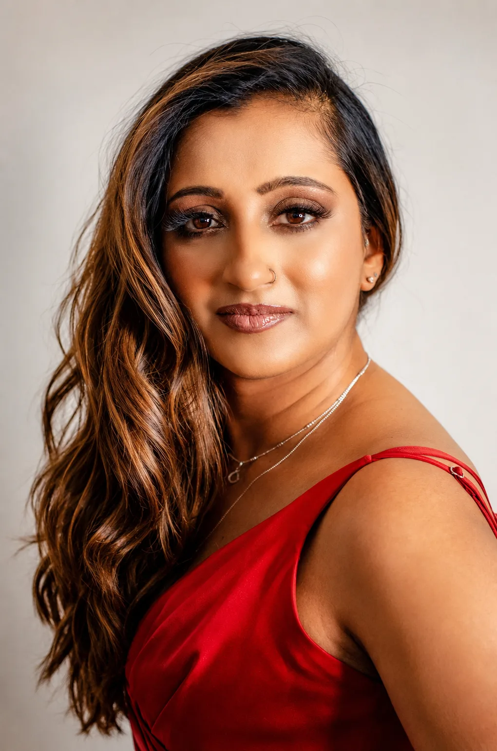 Party makeup - warm brown smoky eye, matte mauve lip and red dress by MZ Makeup Bedfordshire