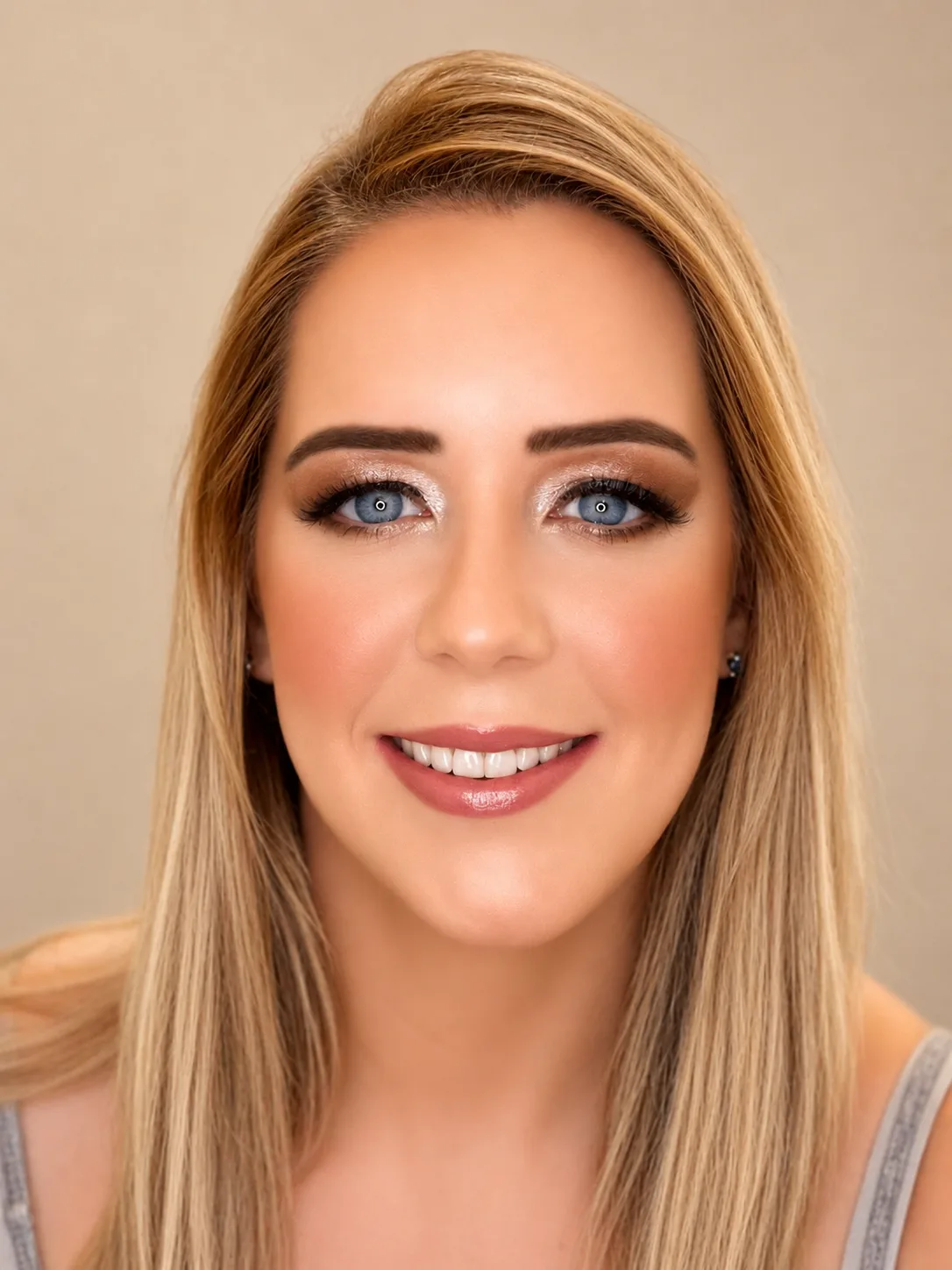 Party makeup for blue-eyed blonde - warm brown smoky eye and soft rose lip by MZ Makeup Bedfordshire
