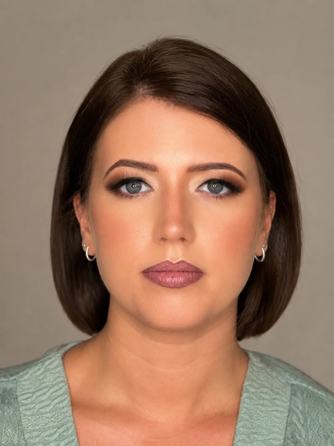 Party makeup - warm taupe smoky eye and deep mauve-pink lip on short brunette bob by MZ Makeup