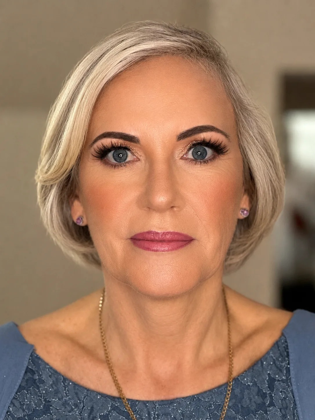 Elegant mature party makeup - defined brows, voluminous lashes, rose-mauve lip and platinum bob by MZ Makeup