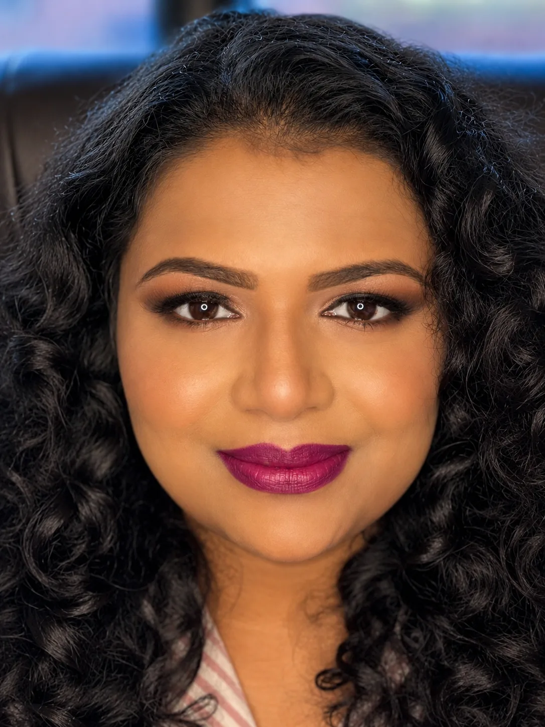 Party makeup - warm brown smoky eye and bold fuchsia-plum lip with natural curly hair by MZ Makeup