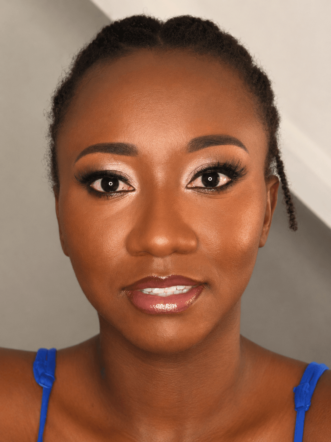 Party makeup for Black client — warm bronze eye, glossy soft pink lip and natural hair up by MZ Makeup