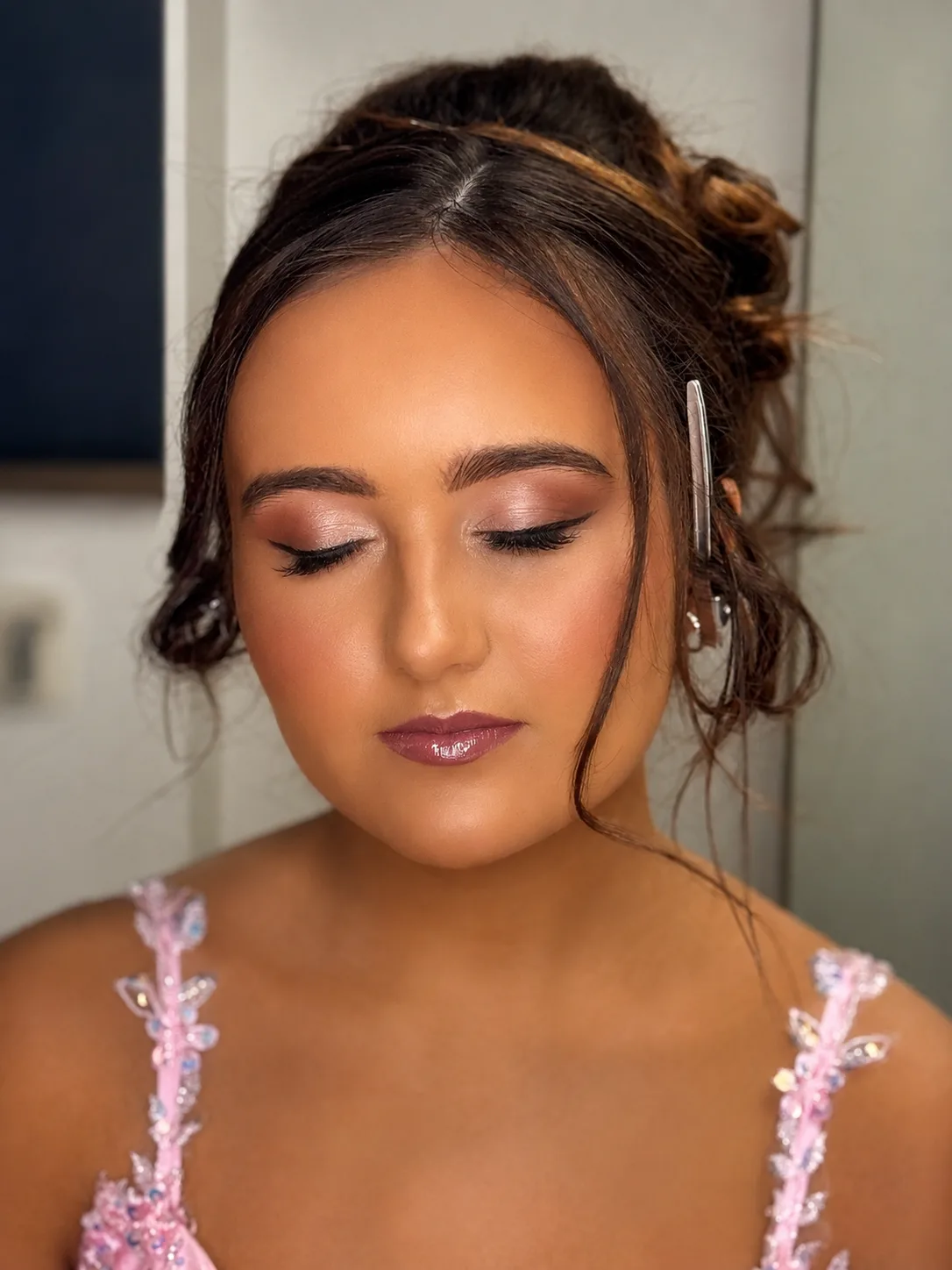 Prom makeup eyes closed - warm bronze eye, berry-mauve lip and pink floral prom dress by MZ Makeup
