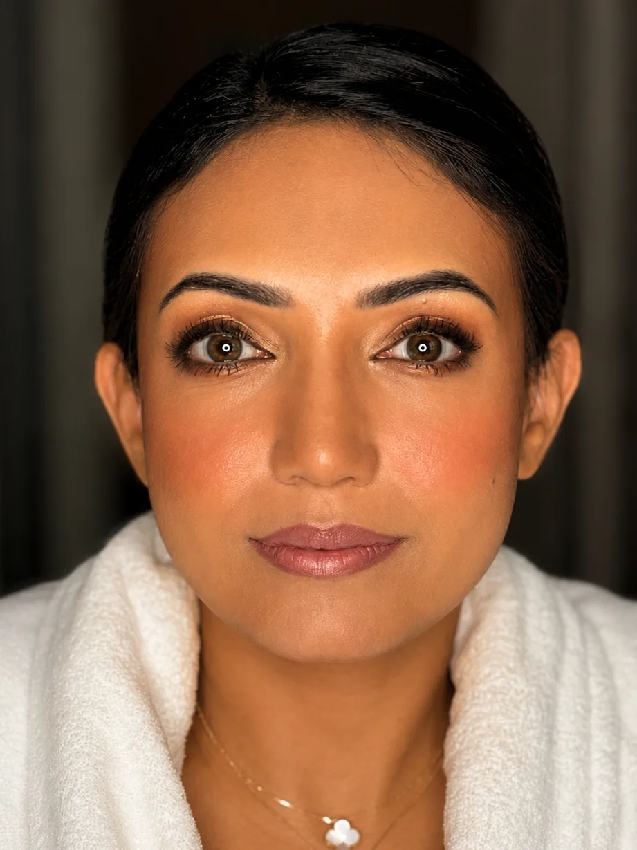 Natural Bridal Makeup - MZ Makeup, Bedfordshire Natural bridal makeup for medium/tan skin - flawless complexion, warm bronze eye, rose-flush cheeks and soft nude-mauve lip in white robe by MZ Makeup Bedfordshire