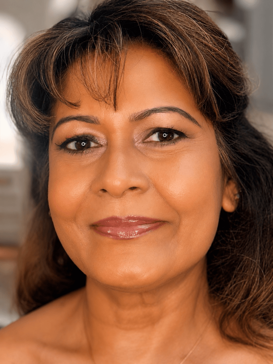 Soft Taupe Smoky Eye Party Makeup | MZ Makeup Bedfordshire Party makeup with soft taupe smoky eye and glossy mauve-nude lip on mature skin by MZ Makeup Bedfordshire