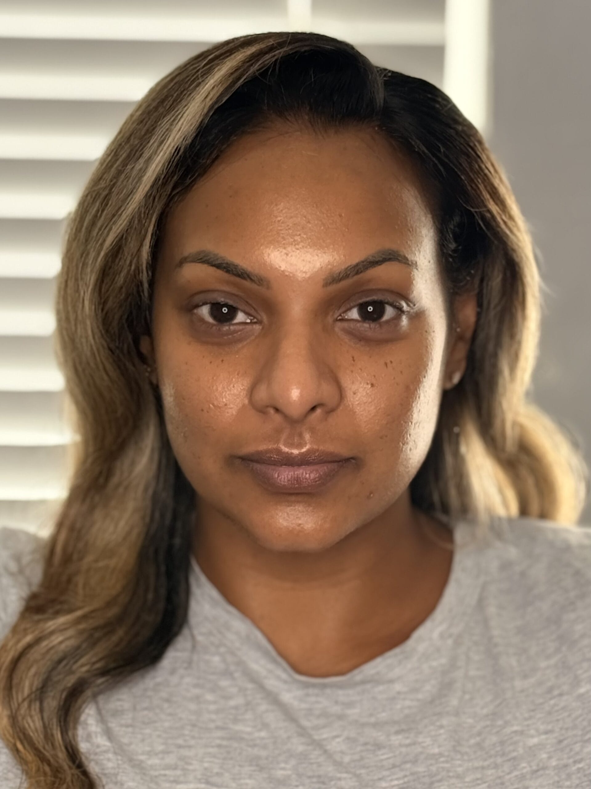 Before Silver Glitter Smoky Eye Party Makeup - MZ Makeup Bare skin before party makeup with long honey-highlighted waves, by MZ Makeup mobile makeup artist